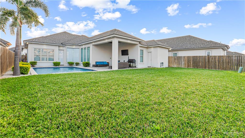 1505 Duke Street Mission, TX 78572 - Photo 34 of 39 a front view of a house with a garden and yard
