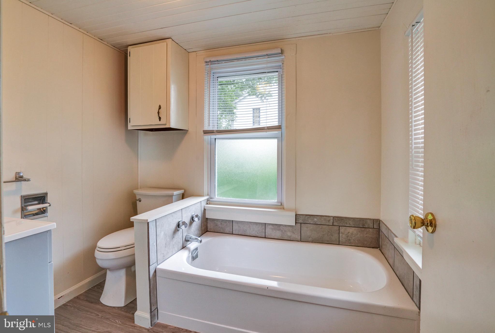 74 Baptist Church Road Spring City, PA 19475 - Photo 11 of 24 a white bath tub sitting next to a toilet