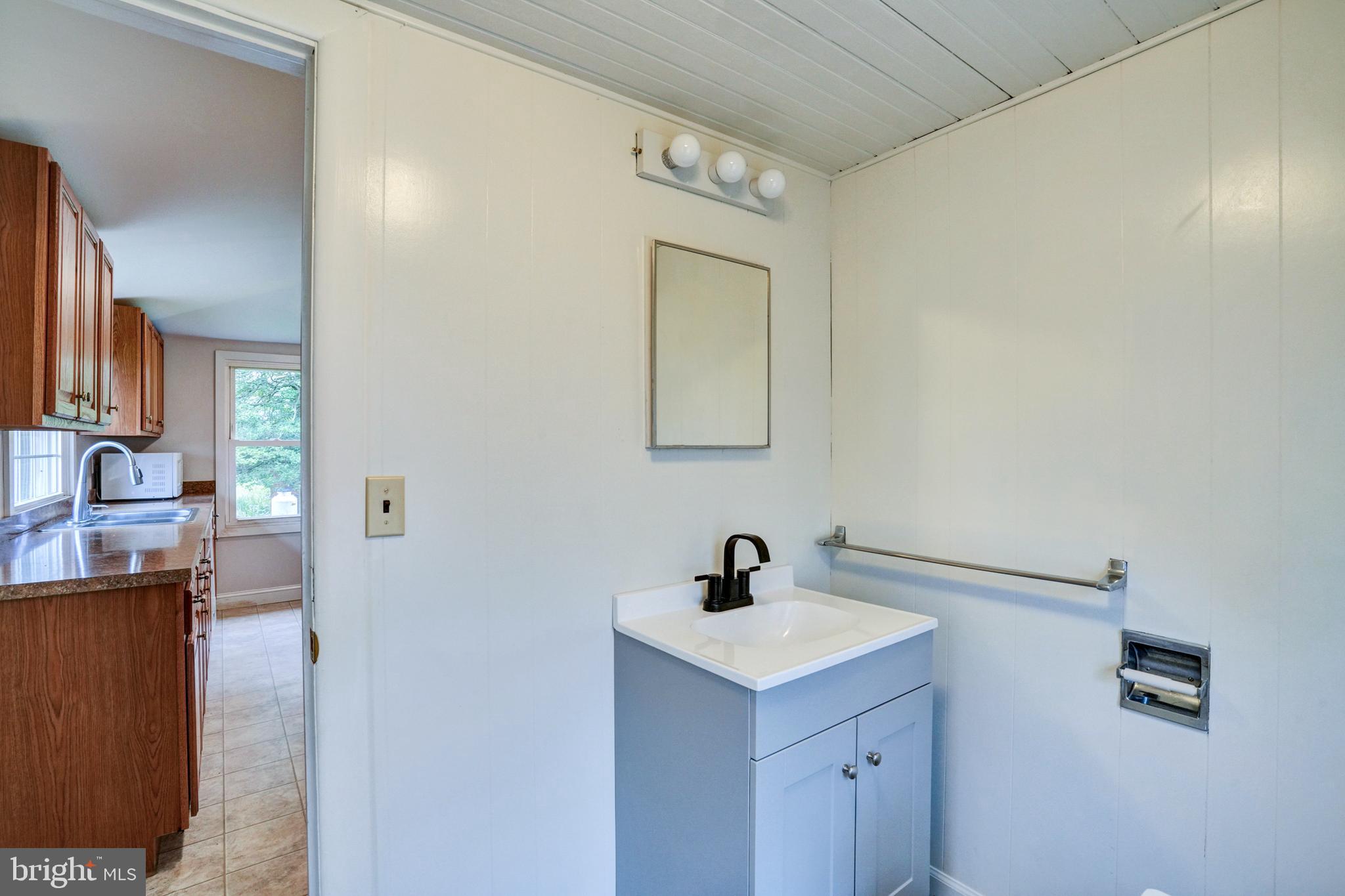 74 Baptist Church Road Spring City, PA 19475 - Photo 12 of 24 a bathroom with a sink and a mirror