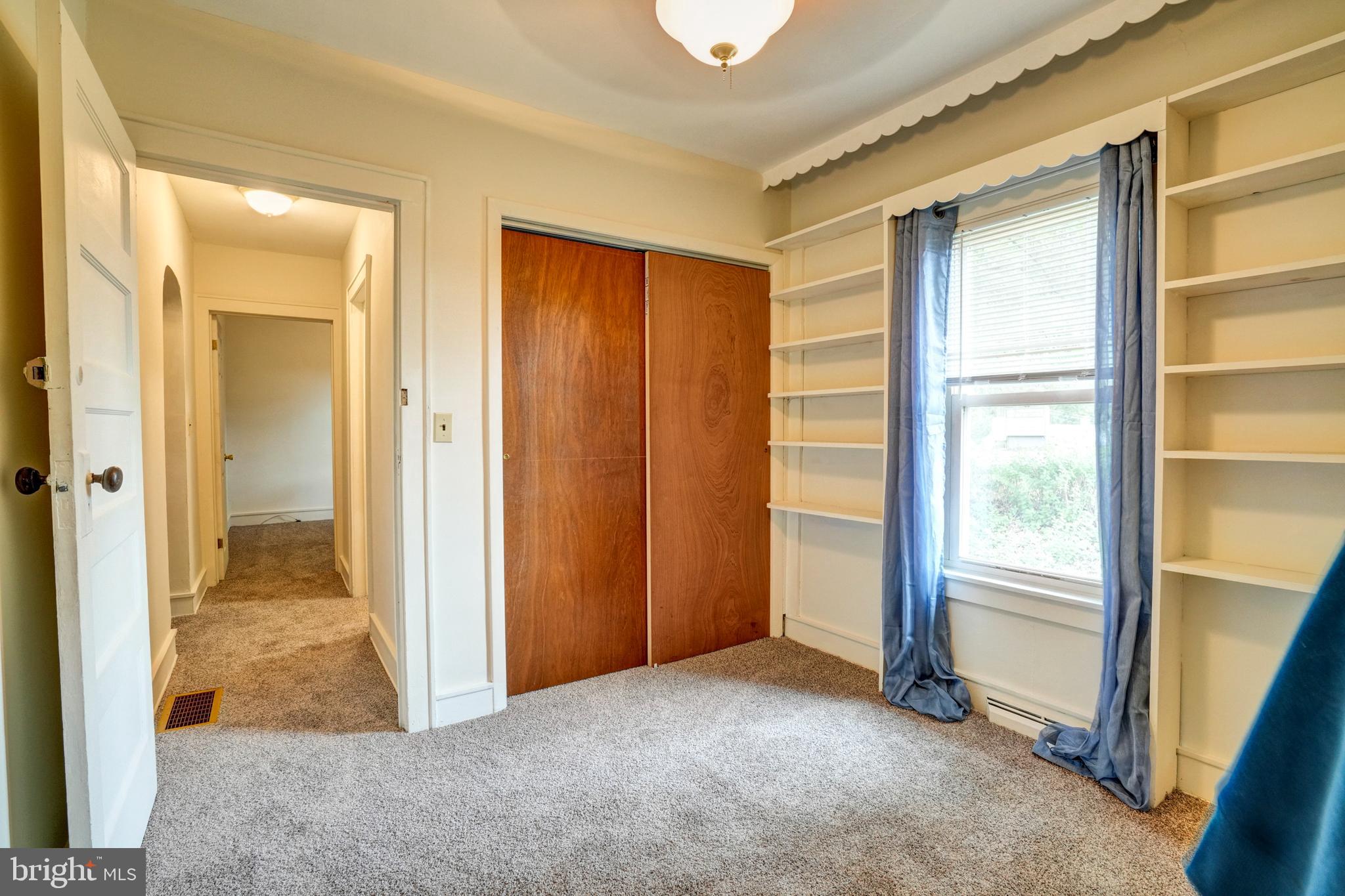 74 Baptist Church Road Spring City, PA 19475 - Photo 19 of 24 a view of an empty room with wooden floor and a bathroom