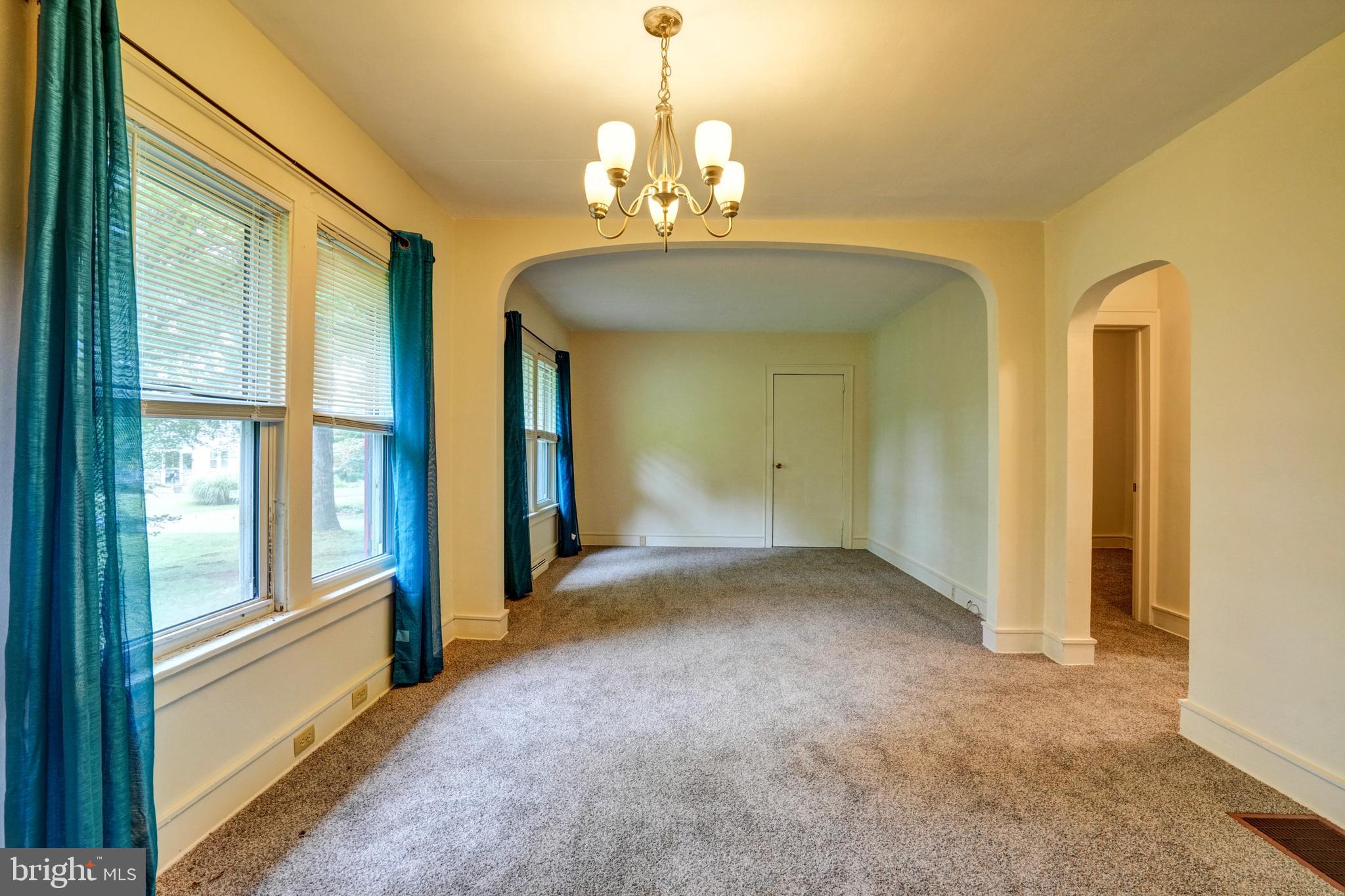 74 Baptist Church Road Spring City, PA 19475 - Photo 6 of 24 a view of a hallway with windows and chandelier