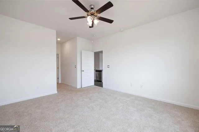 a bathroom with a granite countertop sink and a bathtub