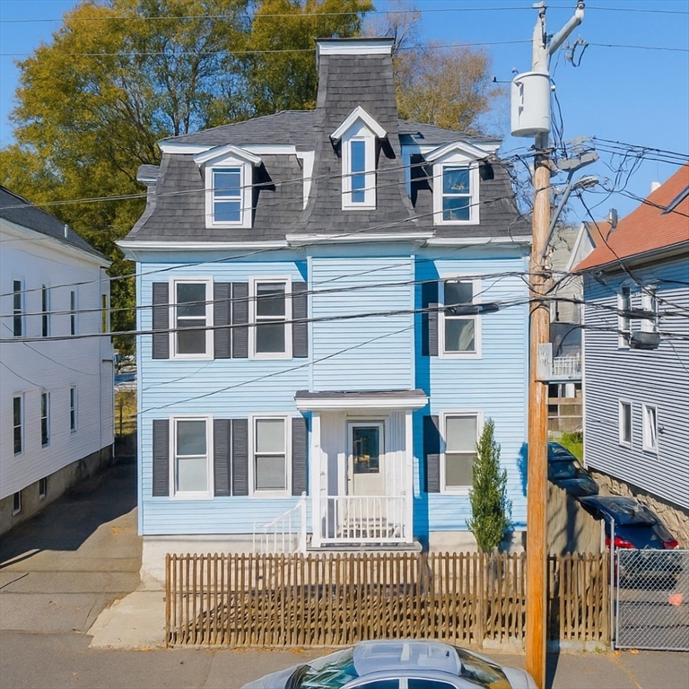 145 State Street New Bedford, MA 02740 - Photo 1 of 15 a front view of a house with a garden