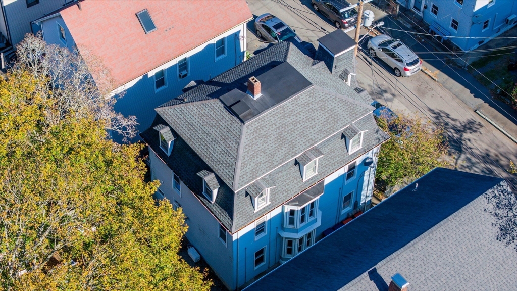 145 State Street New Bedford, MA 02740 - Photo 13 of 15 a view of a house with brick walls and wooden stairs