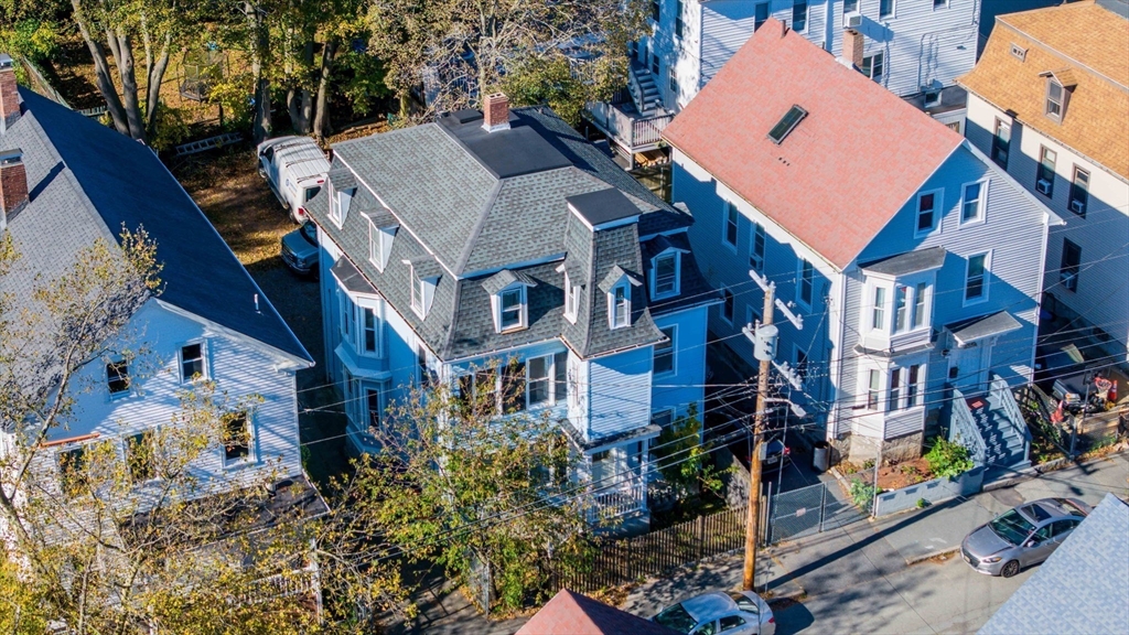 145 State Street New Bedford, MA 02740 - Photo 4 of 15 an aerial view of multiple houses with a yard