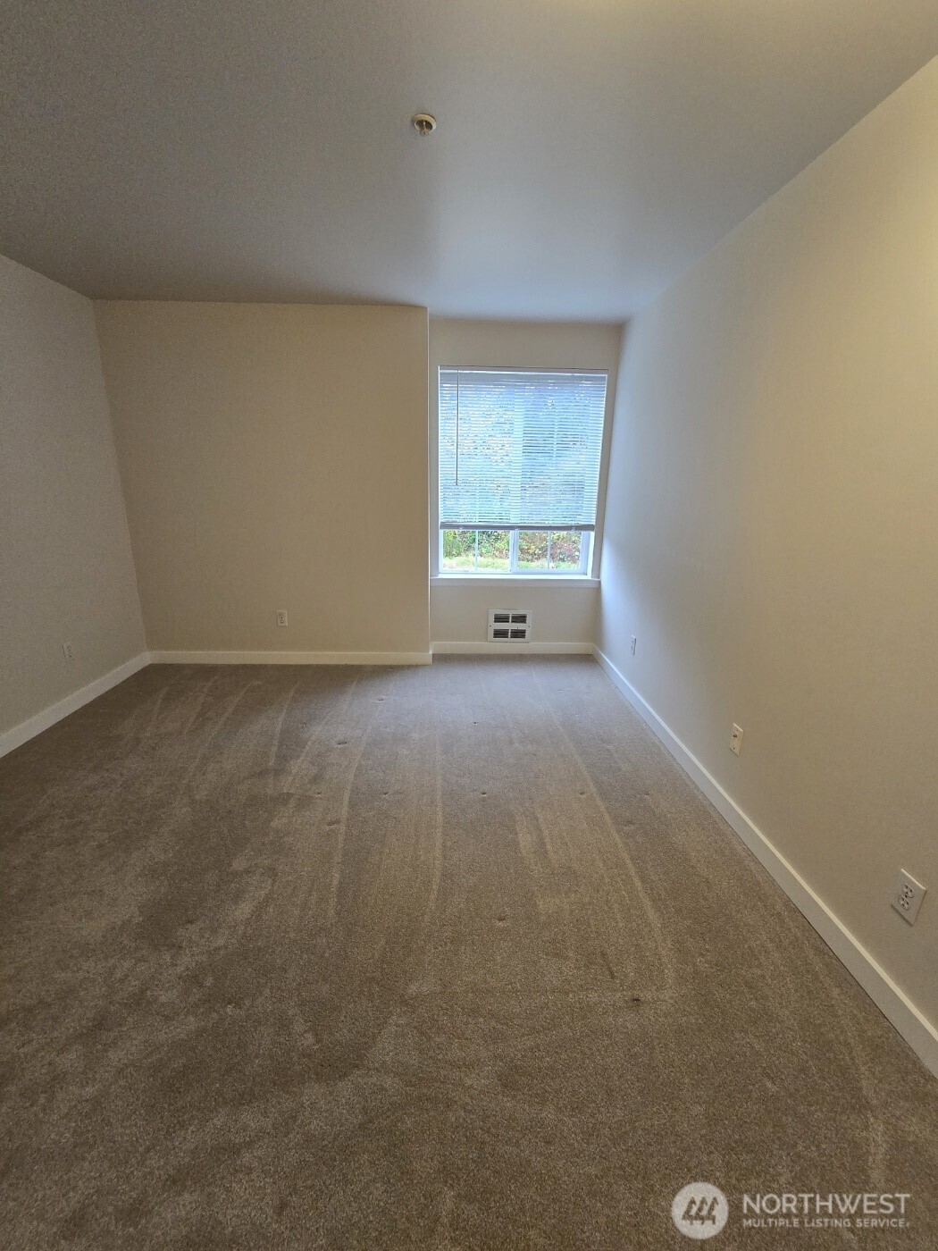 7207 210th Street Southwest, Unit 102 Edmonds, WA 98026 - Photo 11 of 14 a view of an empty room with a window