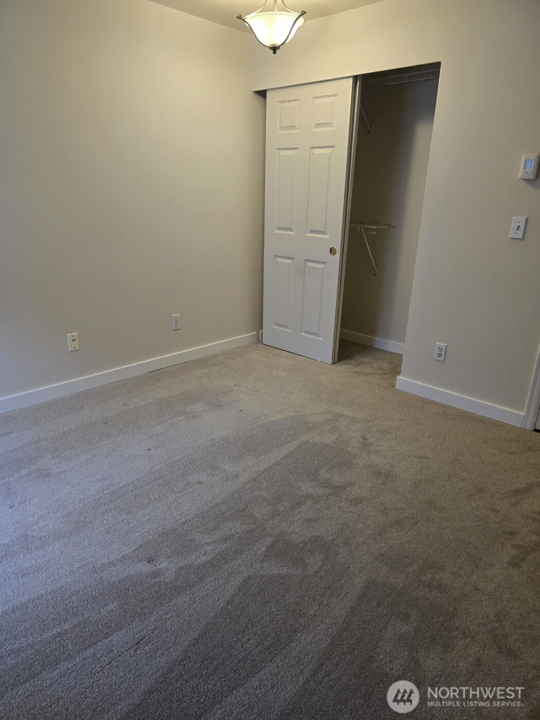 7207 210th Street Southwest, Unit 102 Edmonds, WA 98026 - Photo 12 of 14 an empty room with closet
