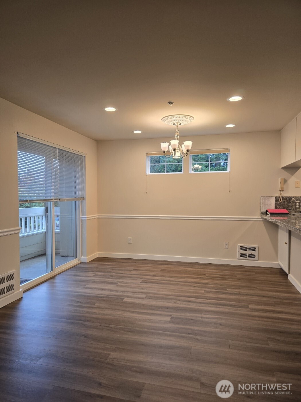 7207 210th Street Southwest, Unit 102 Edmonds, WA 98026 - Photo 3 of 14 a view of a kitchen with a sink and a refrigerator