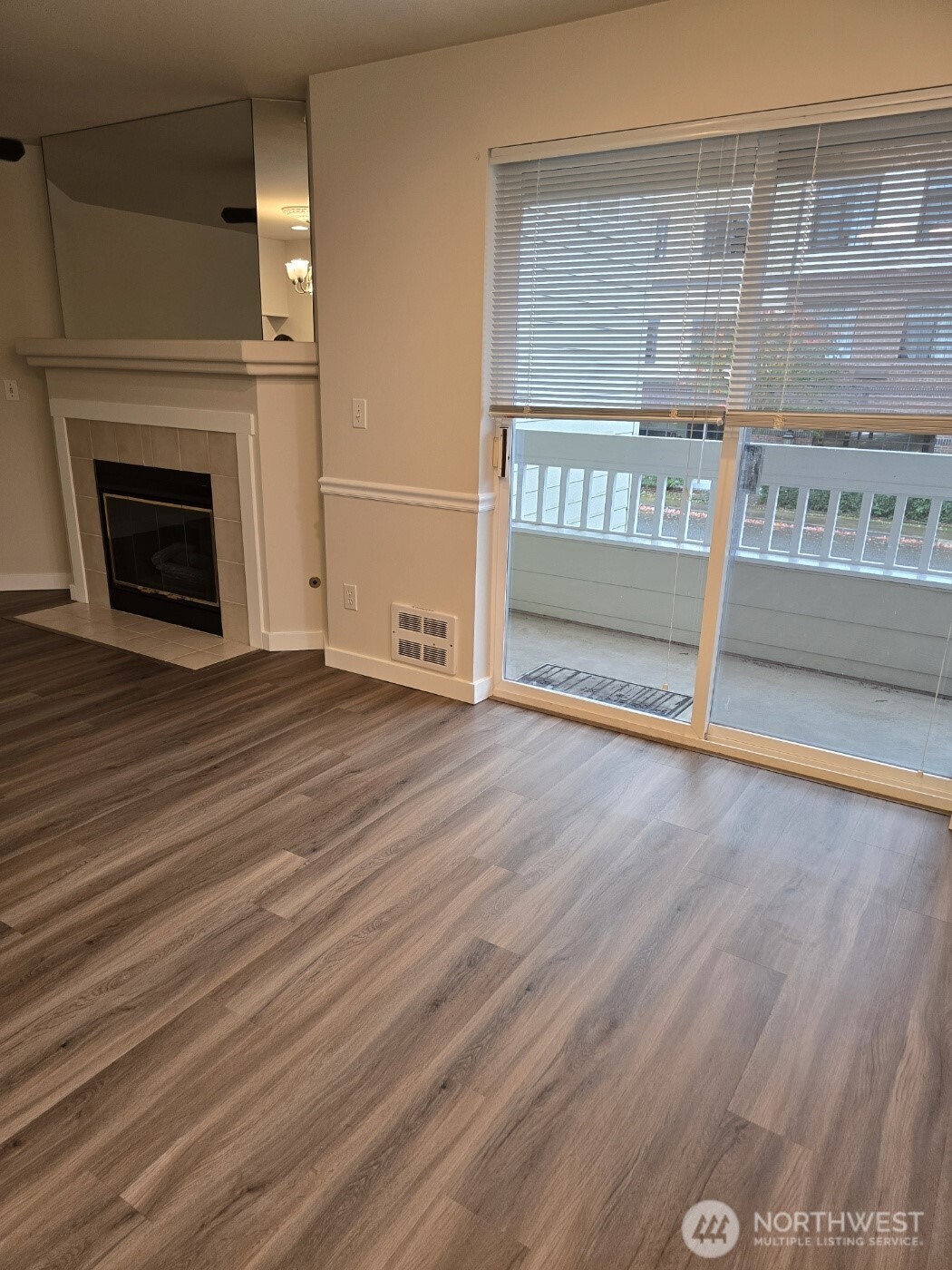 7207 210th Street Southwest, Unit 102 Edmonds, WA 98026 - Photo 4 of 14 a view of a room with wooden floor