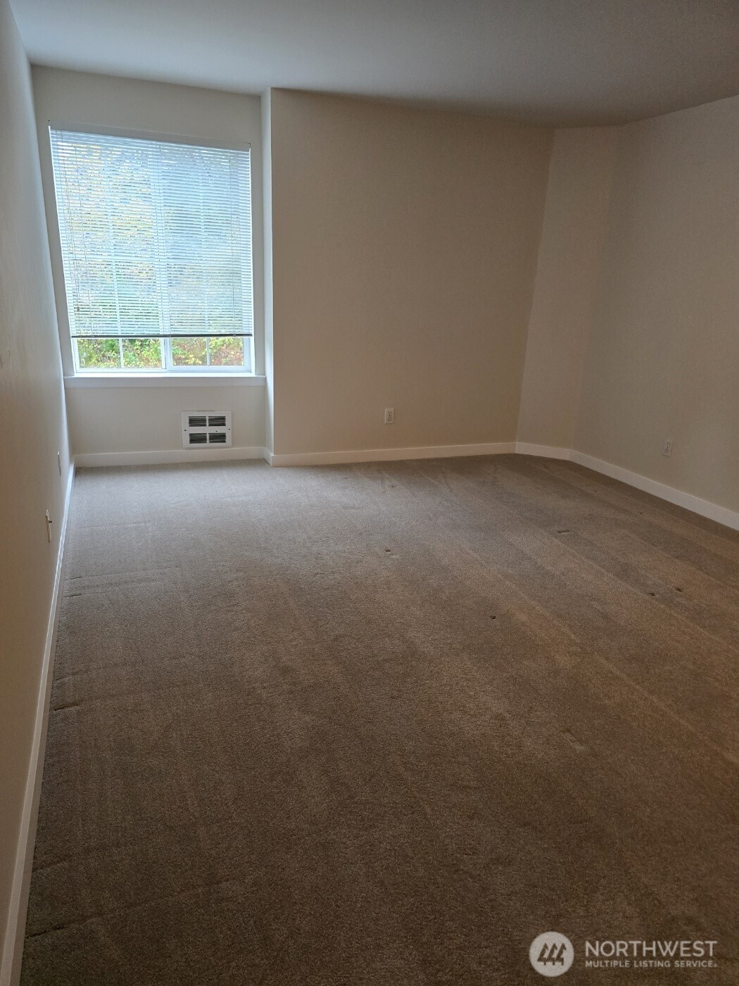 7207 210th Street Southwest, Unit 102 Edmonds, WA 98026 - Photo 8 of 14 an empty room with a window