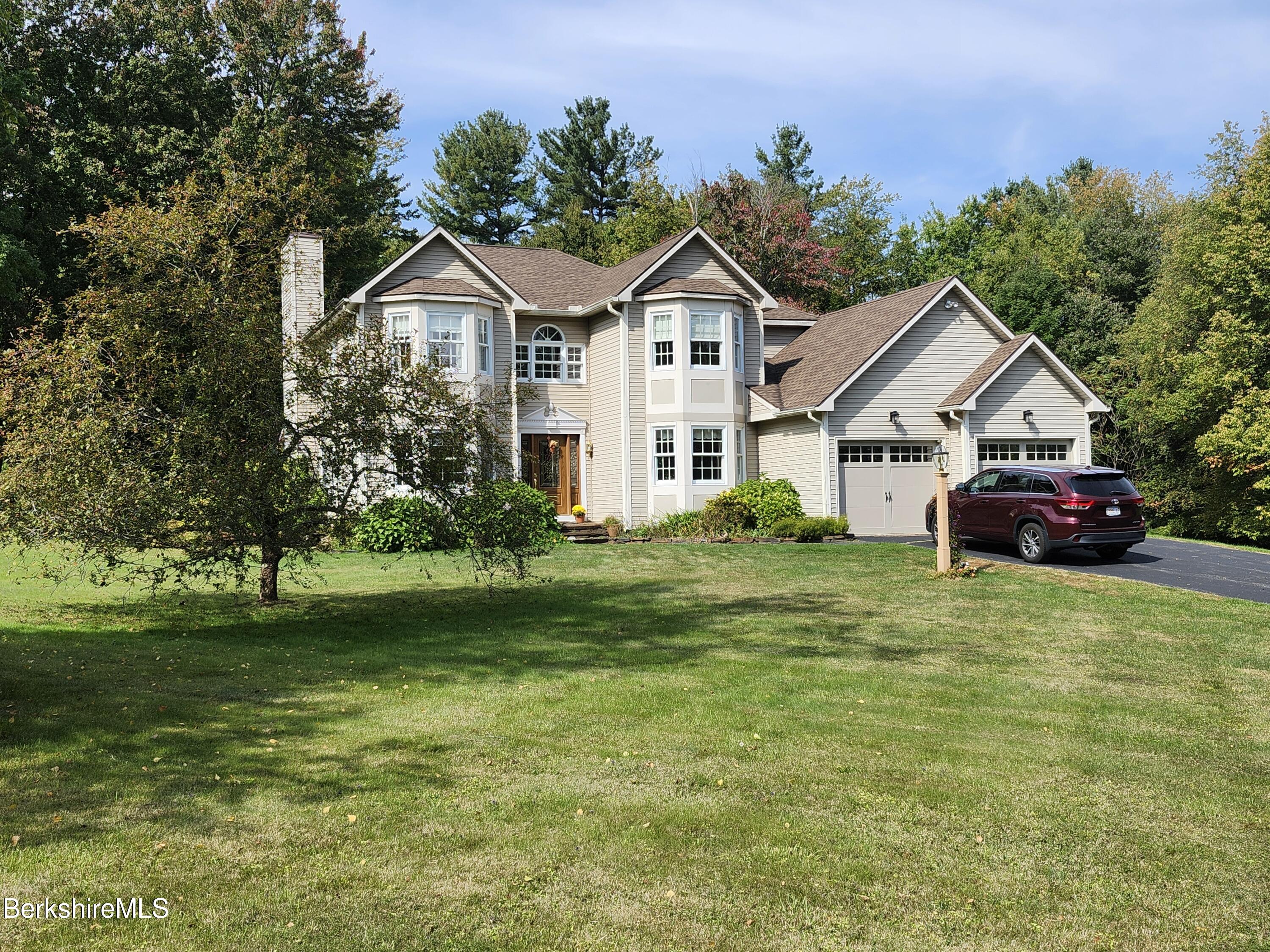 10 Lillybrook Road Pittsfield, MA 01201 - Photo 13 of 91 a front view of a house with a garden