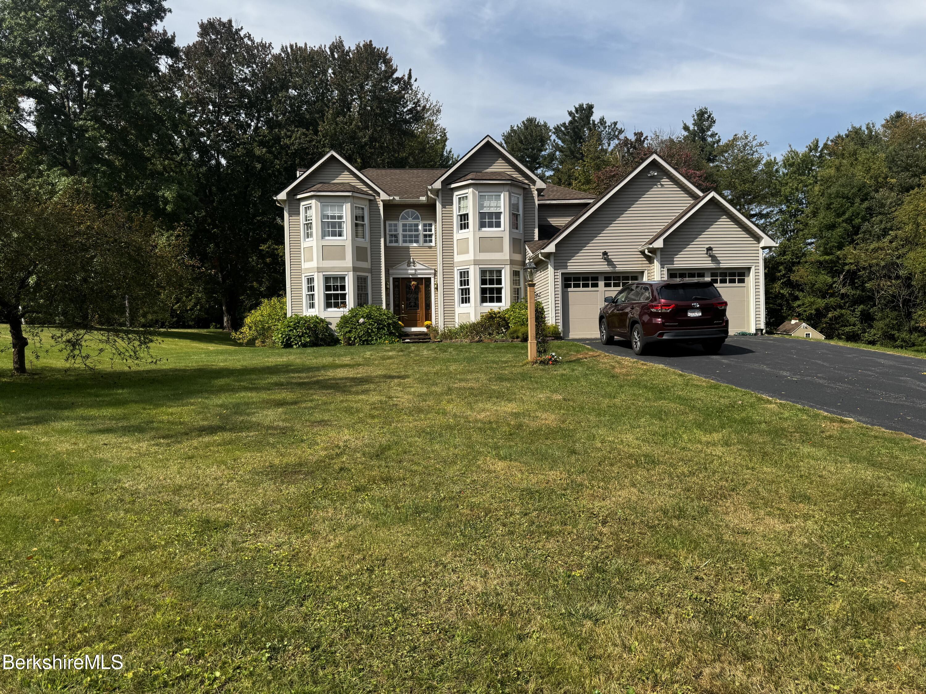 10 Lillybrook Road Pittsfield, MA 01201 - Photo 14 of 91 a front view of a house with a garden and trees