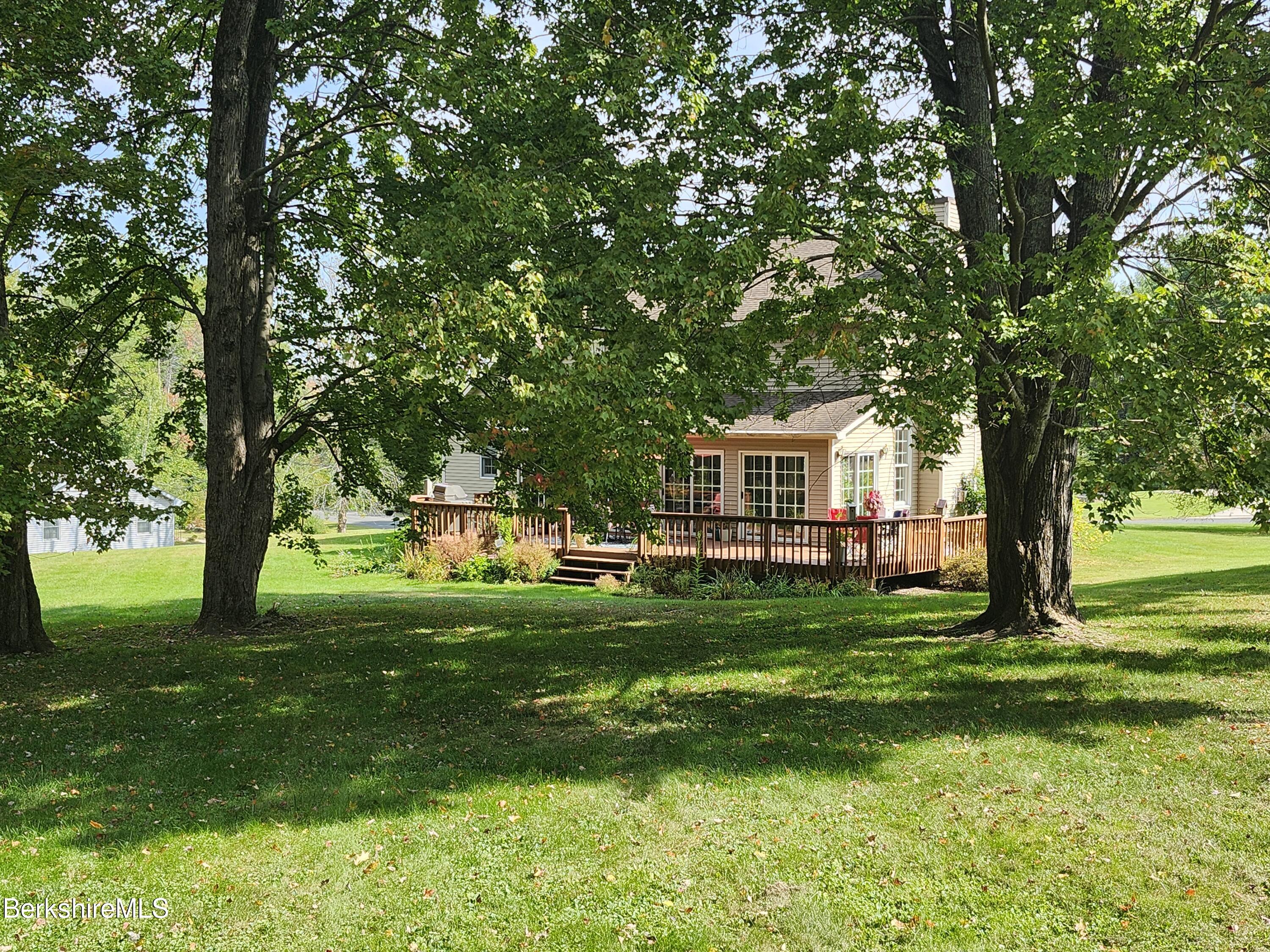 10 Lillybrook Road Pittsfield, MA 01201 - Photo 26 of 91 a backyard of a house with table and chairs