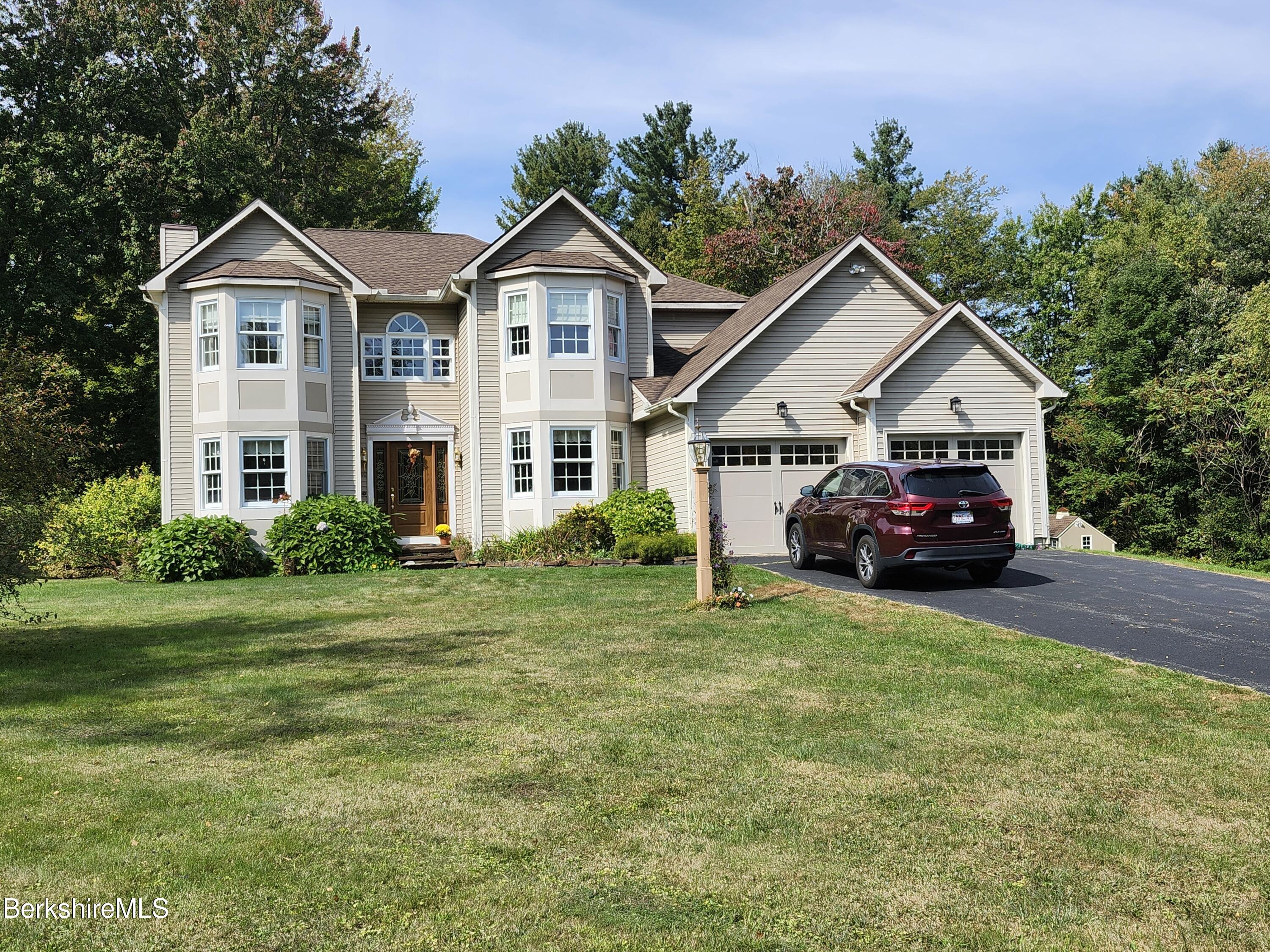 10 Lillybrook Road Pittsfield, MA 01201 - Photo 6 of 91 a front view of a house with a yard