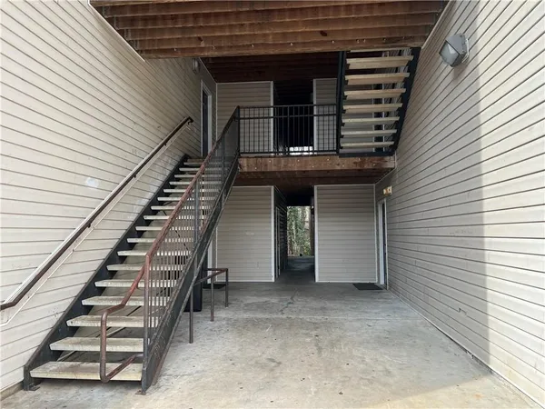 a view of a house with entryway and wooden floor