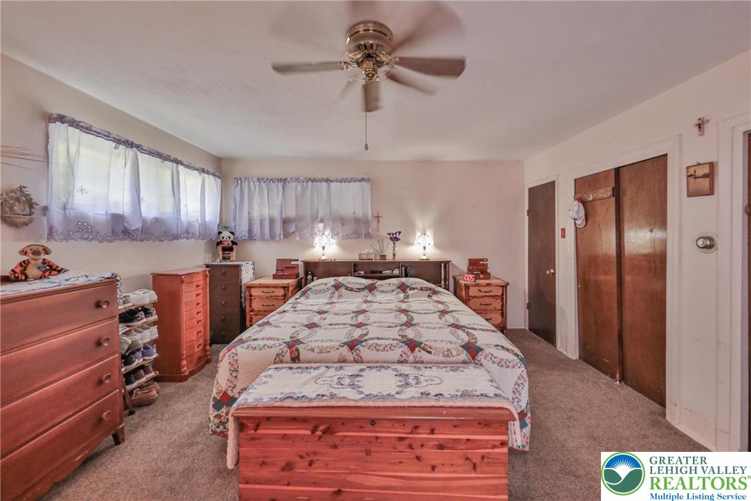 331 Cranberry Creek Road Cresco, PA 18326 - Photo 45 of 95 A comfortable bedroom with soft carpeting offers ample space and a ceiling fan for year-round comfort.