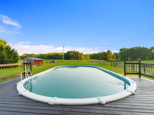 a view of a swimming pool with a lake view