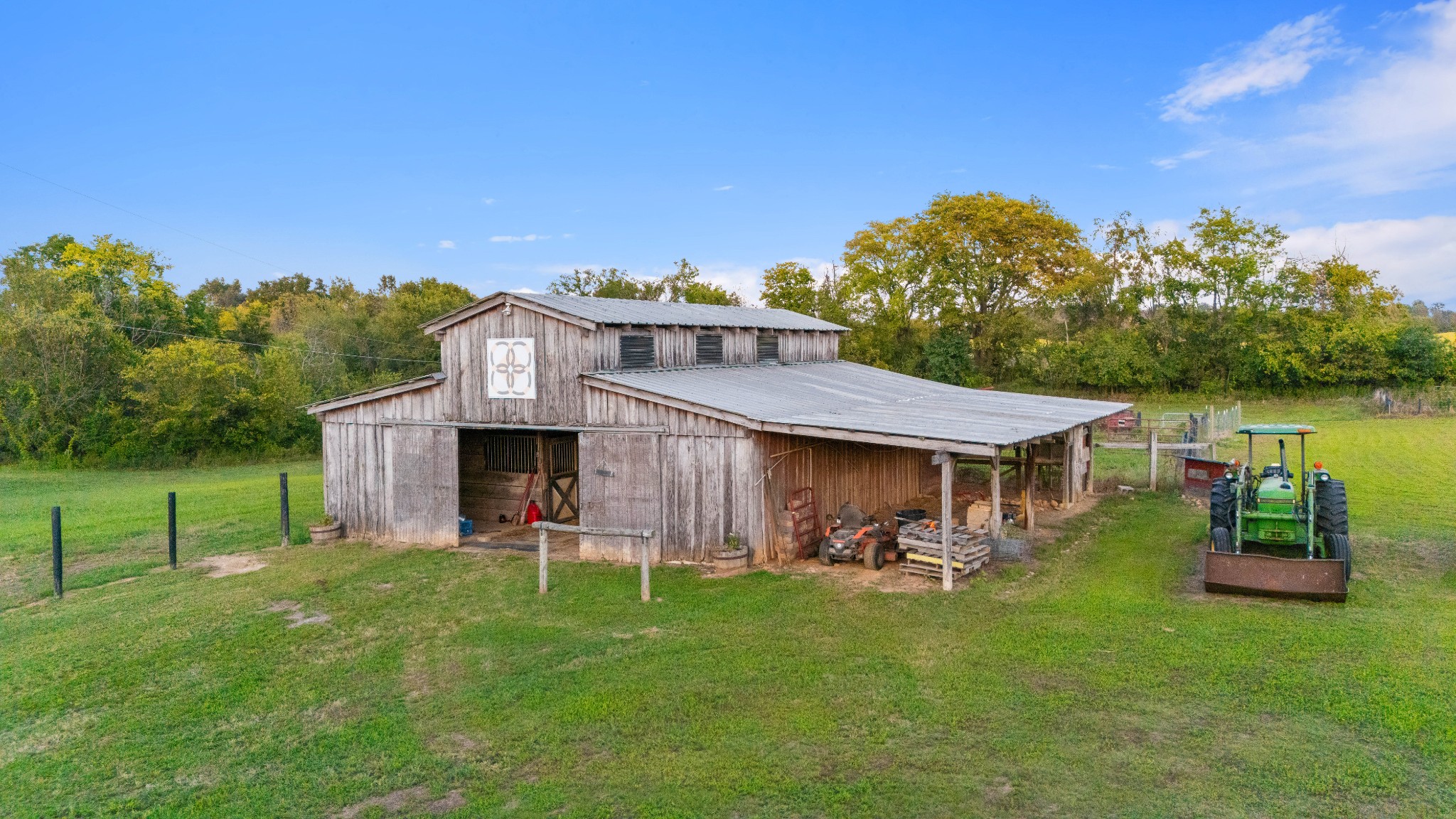 5439 Minnis Road Springfield, TN 37172 - Photo 35 of 43 a view of a patio with table and chairs under an umbrella next to a yard