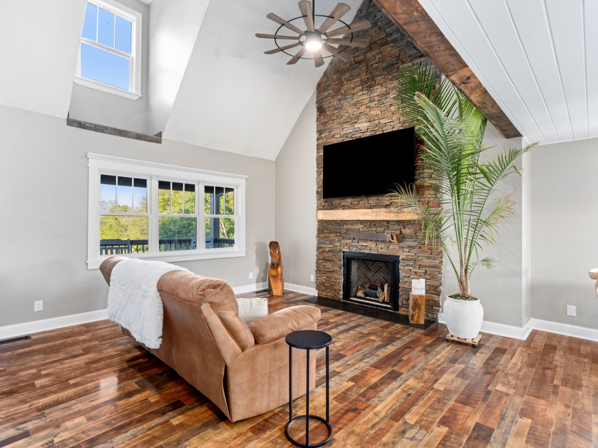 5439 Minnis Road Springfield, TN 37172 - Photo 5 of 43 a living room with furniture a fireplace and a flat screen tv