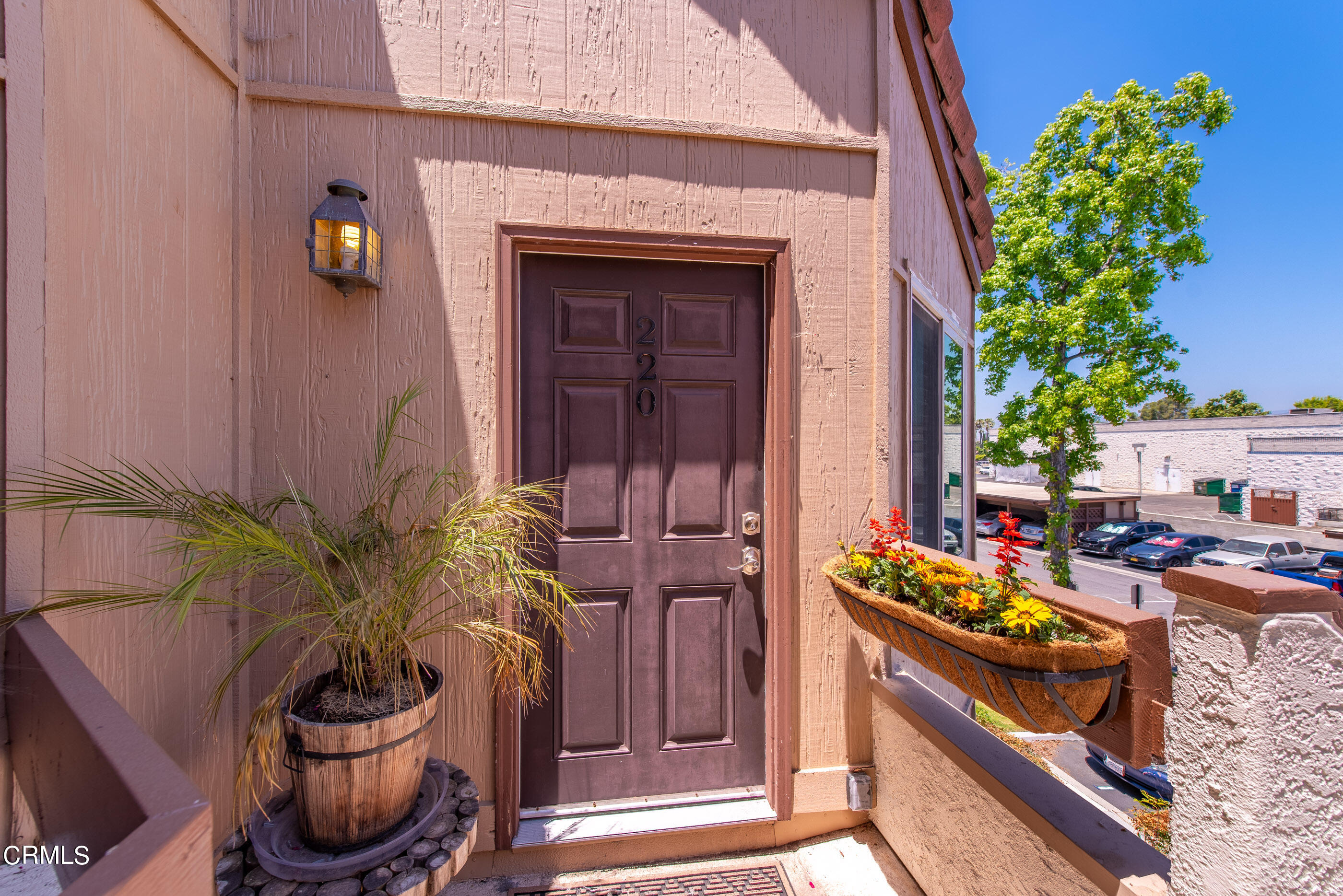 1718 Sinaloa Road, Unit 220 Simi Valley, CA 93065 - Photo 2 of 35 a potted plant sitting in front of a building