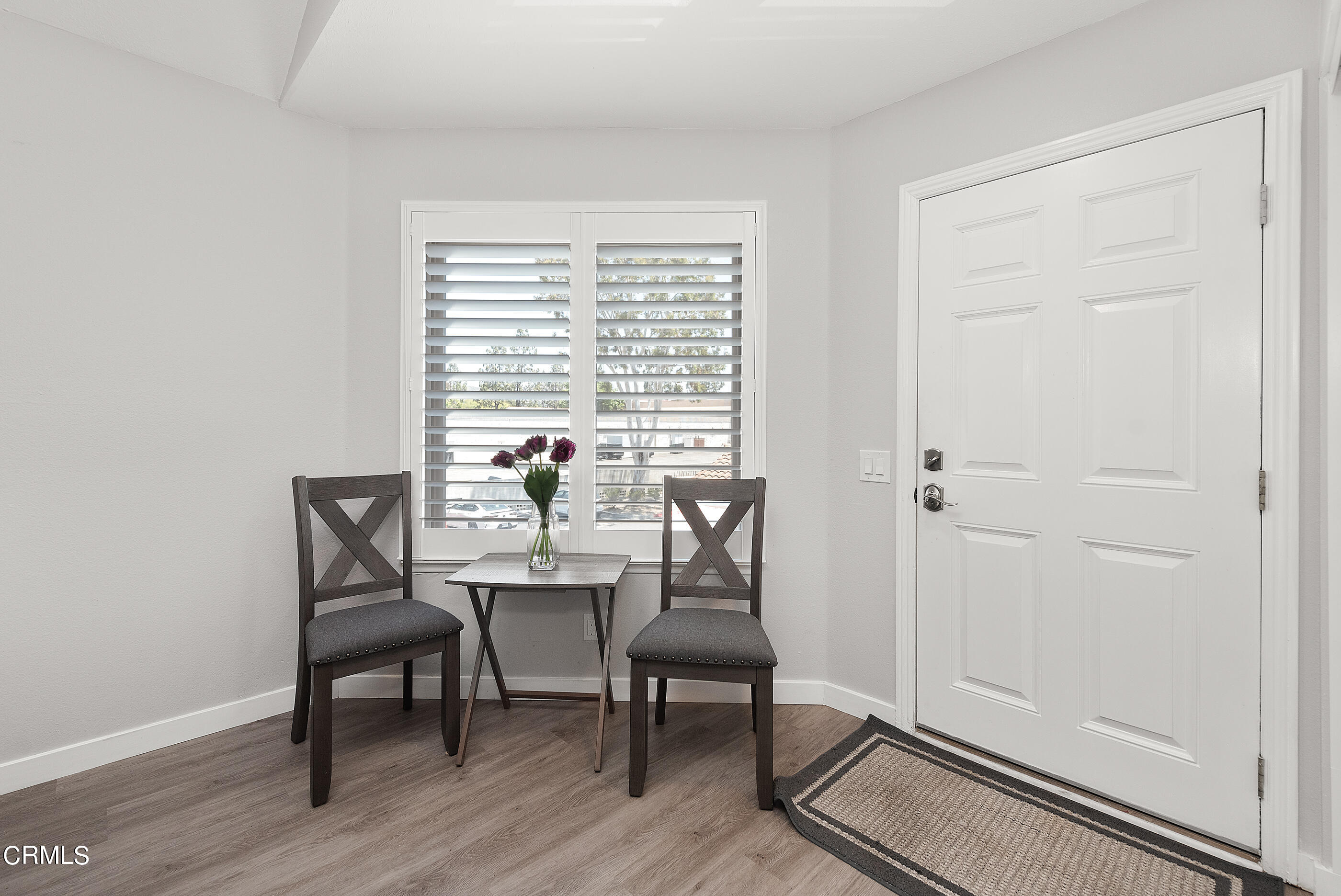 1718 Sinaloa Road, Unit 220 Simi Valley, CA 93065 - Photo 6 of 35 a view of a dining room with furniture window and wooden floor