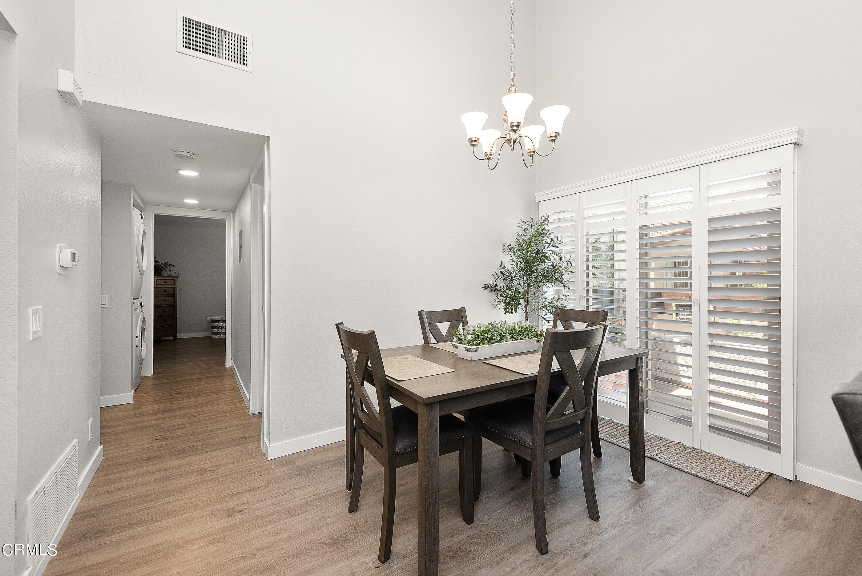 1718 Sinaloa Road, Unit 220 Simi Valley, CA 93065 - Photo 7 of 35 a view of a dining room with furniture and chandelier