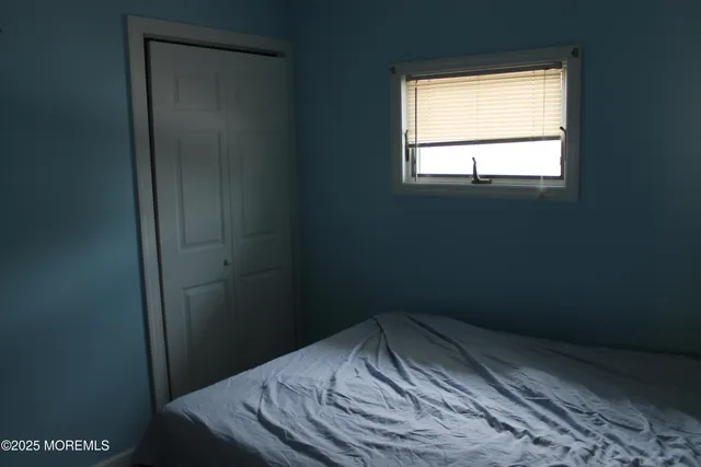a kitchen with a sink a refrigerator and cabinets
