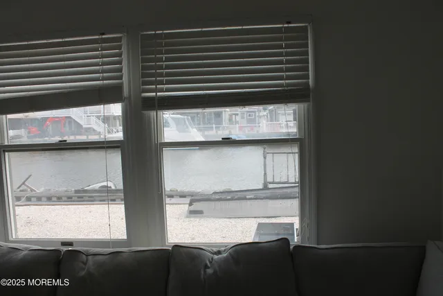 a living room with a couch and a window