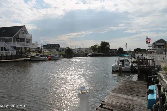 a view of a lake with boats and trees