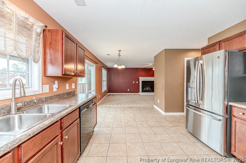 445 Hayden Lane Cameron, NC 28326 - Photo 11 of 49 a kitchen with stainless steel appliances granite countertop a refrigerator and a sink