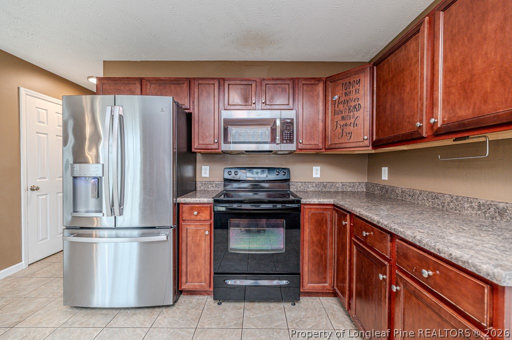 445 Hayden Lane Cameron, NC 28326 - Photo 12 of 49 a kitchen with stainless steel appliances granite countertop a refrigerator stove and sink