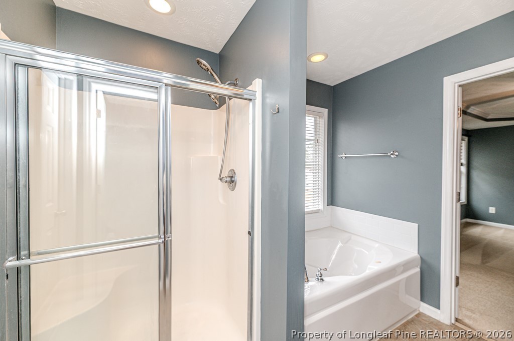 445 Hayden Lane Cameron, NC 28326 - Photo 19 of 49 a bathroom with a tub and shower