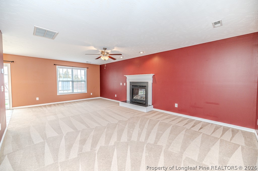 445 Hayden Lane Cameron, NC 28326 - Photo 4 of 49 a view of empty room with a fireplace