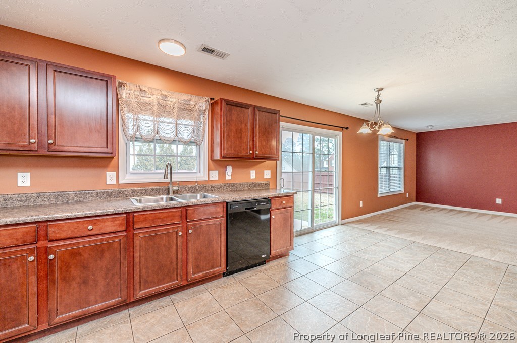 445 Hayden Lane Cameron, NC 28326 - Photo 10 of 49 a large kitchen with granite countertop a stove sink and cabinets