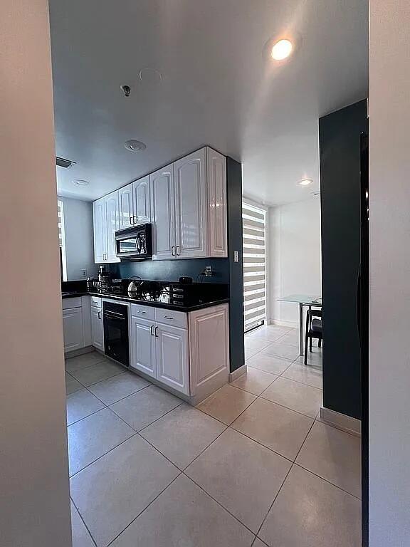 6463 La Costa Drive, Unit 105 Boca Raton, FL 33433 - Photo 7 of 40 a kitchen with cabinets and appliances
