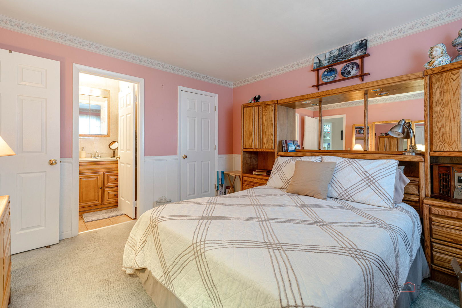 1157 Middlebury Lane, Unit B1 Wheeling, IL 60090 - Photo 11 of 18 a bedroom with a bed and a large cabinets