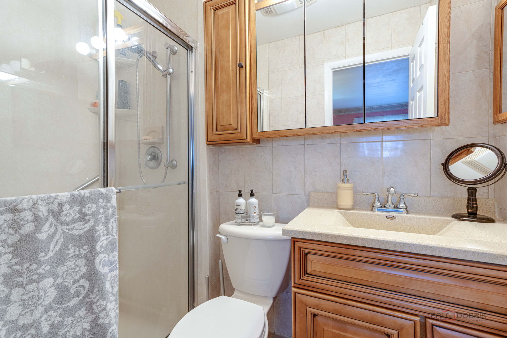 1157 Middlebury Lane, Unit B1 Wheeling, IL 60090 - Photo 12 of 18 a bathroom with a sink toilet and shower