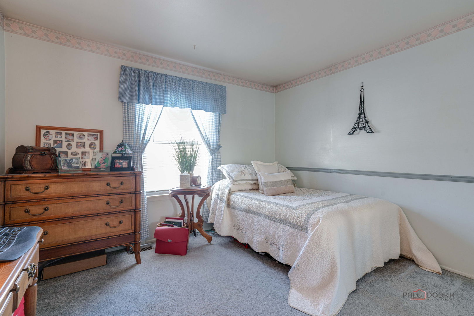 1157 Middlebury Lane, Unit B1 Wheeling, IL 60090 - Photo 13 of 18 a bedroom with a bed and a window