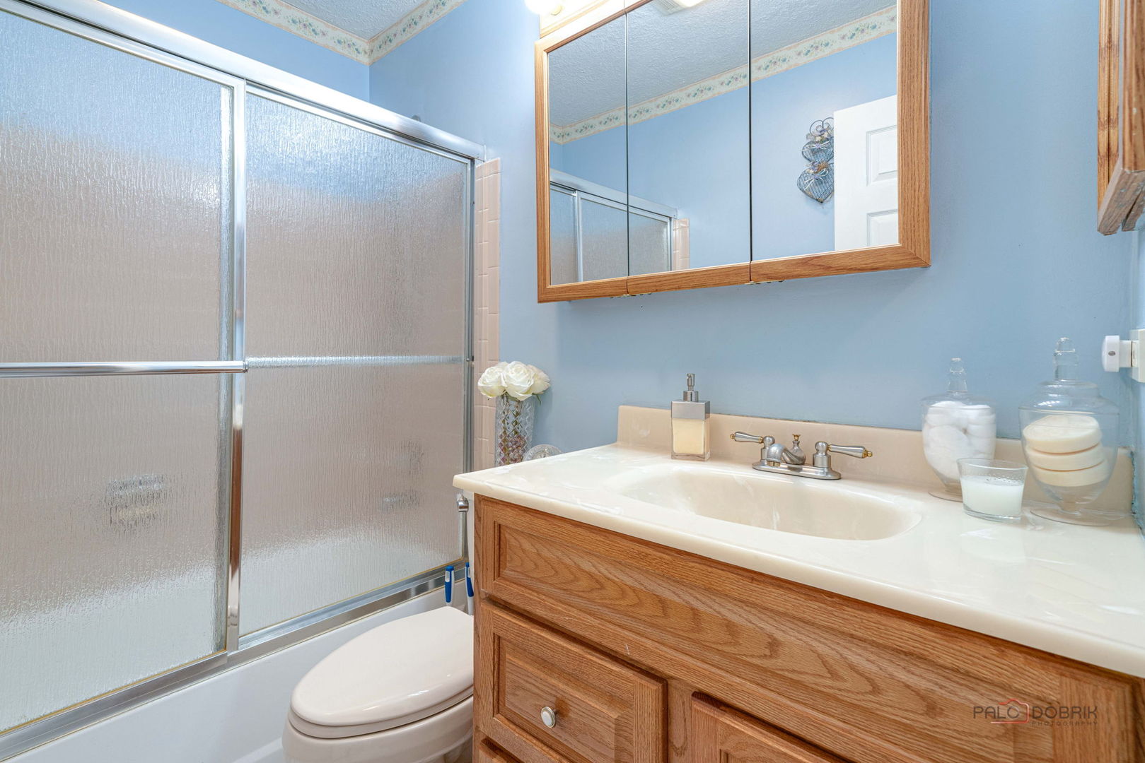 1157 Middlebury Lane, Unit B1 Wheeling, IL 60090 - Photo 14 of 18 a bathroom with a sink a toilet and shower