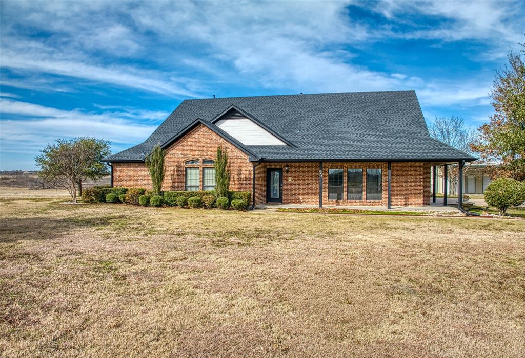 243 Valek Road Ennis, TX 75119 - Photo 1 of 1 View of front of property with a front yard