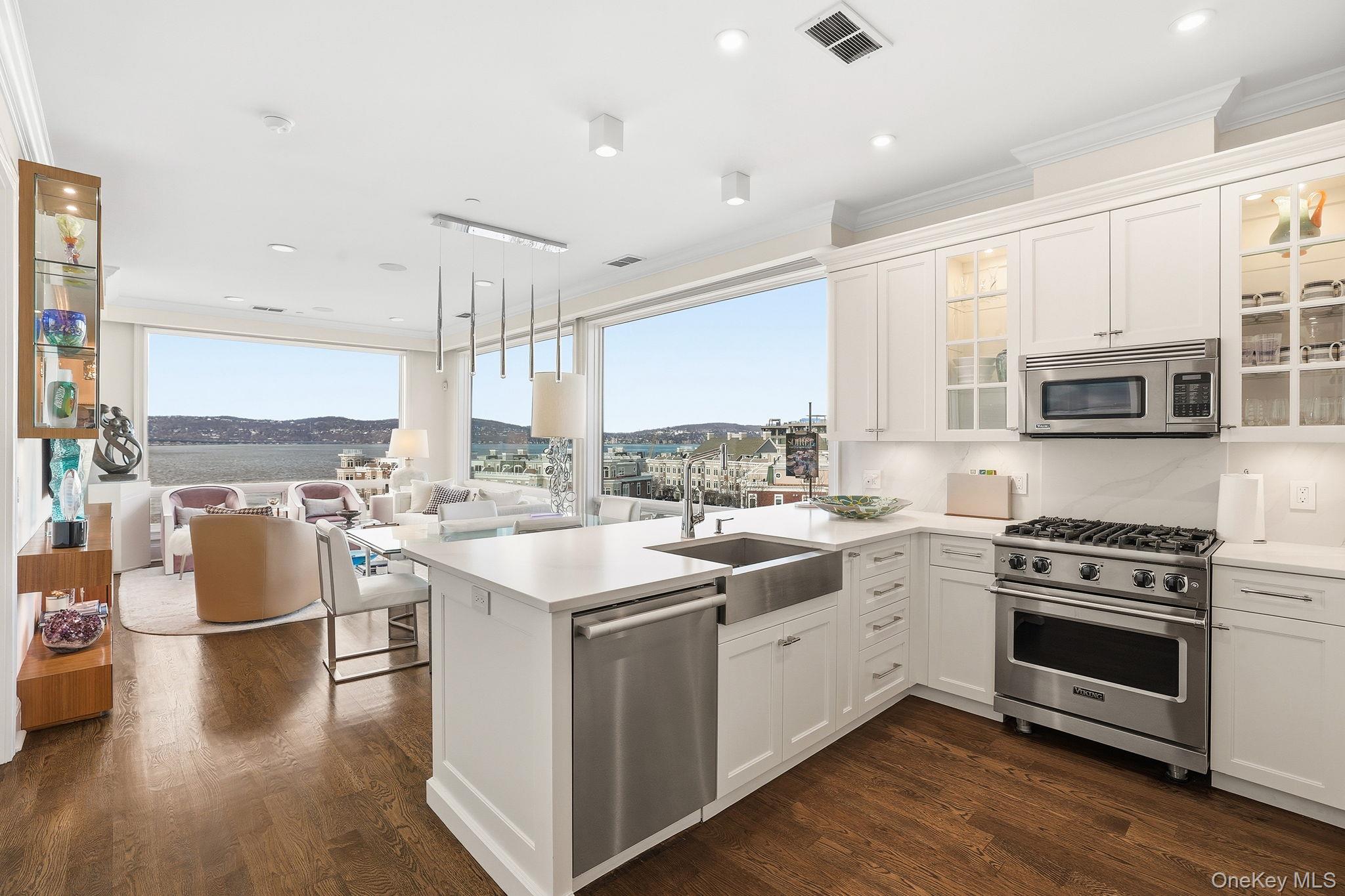 11 River Street, Unit 415 Sleepy Hollow, NY 10591 - Photo 2 of 37 a kitchen with stainless steel appliances a stove sink and cabinets