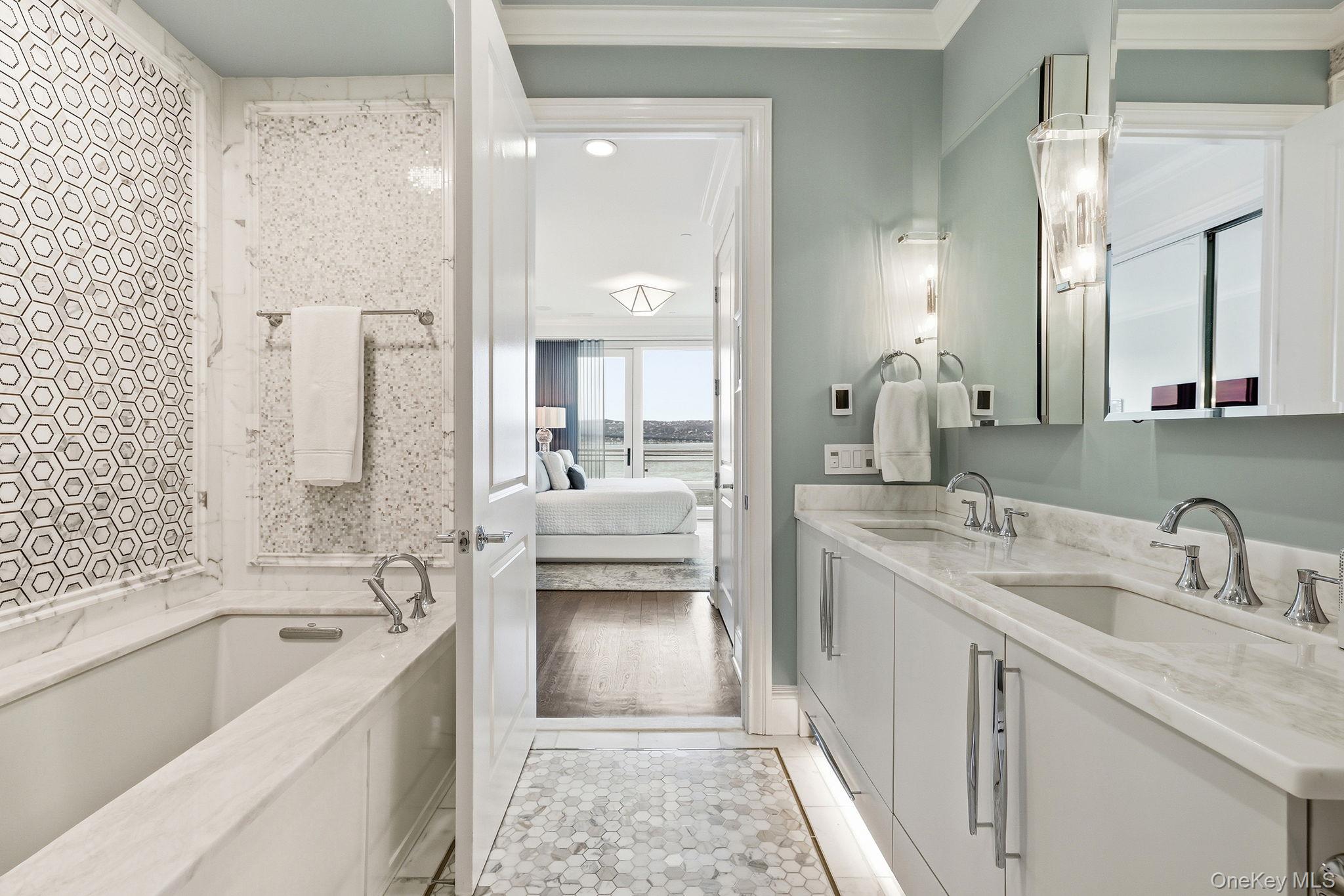 11 River Street, Unit 415 Sleepy Hollow, NY 10591 - Photo 23 of 37 a spacious bathroom with a tub sink shower and mirror