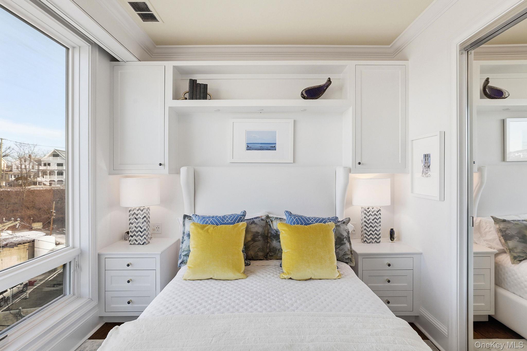 11 River Street, Unit 415 Sleepy Hollow, NY 10591 - Photo 25 of 37 a large white bed in a white room