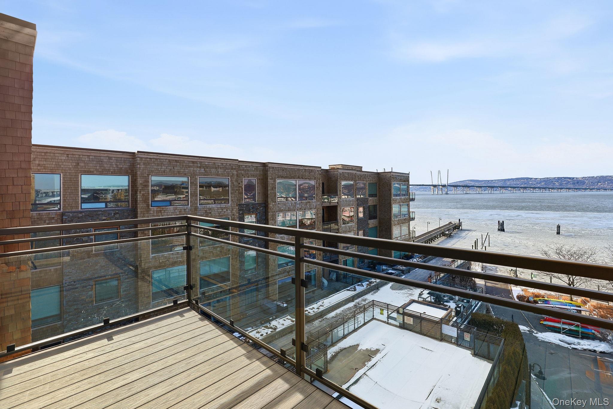 11 River Street, Unit 415 Sleepy Hollow, NY 10591 - Photo 30 of 37 a terrace with a bench and city view