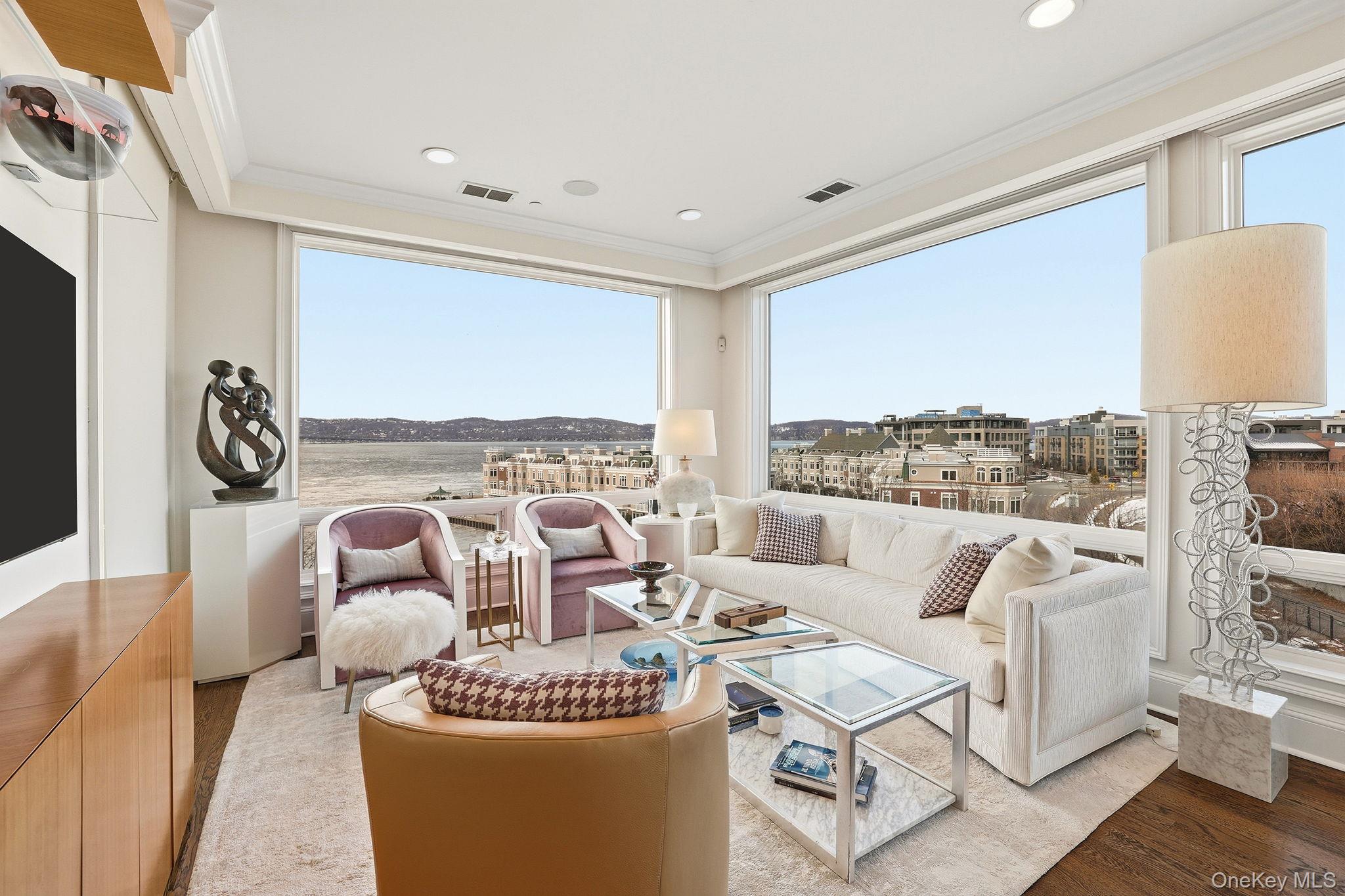 11 River Street, Unit 415 Sleepy Hollow, NY 10591 - Photo 3 of 37 a living room with furniture and a large window