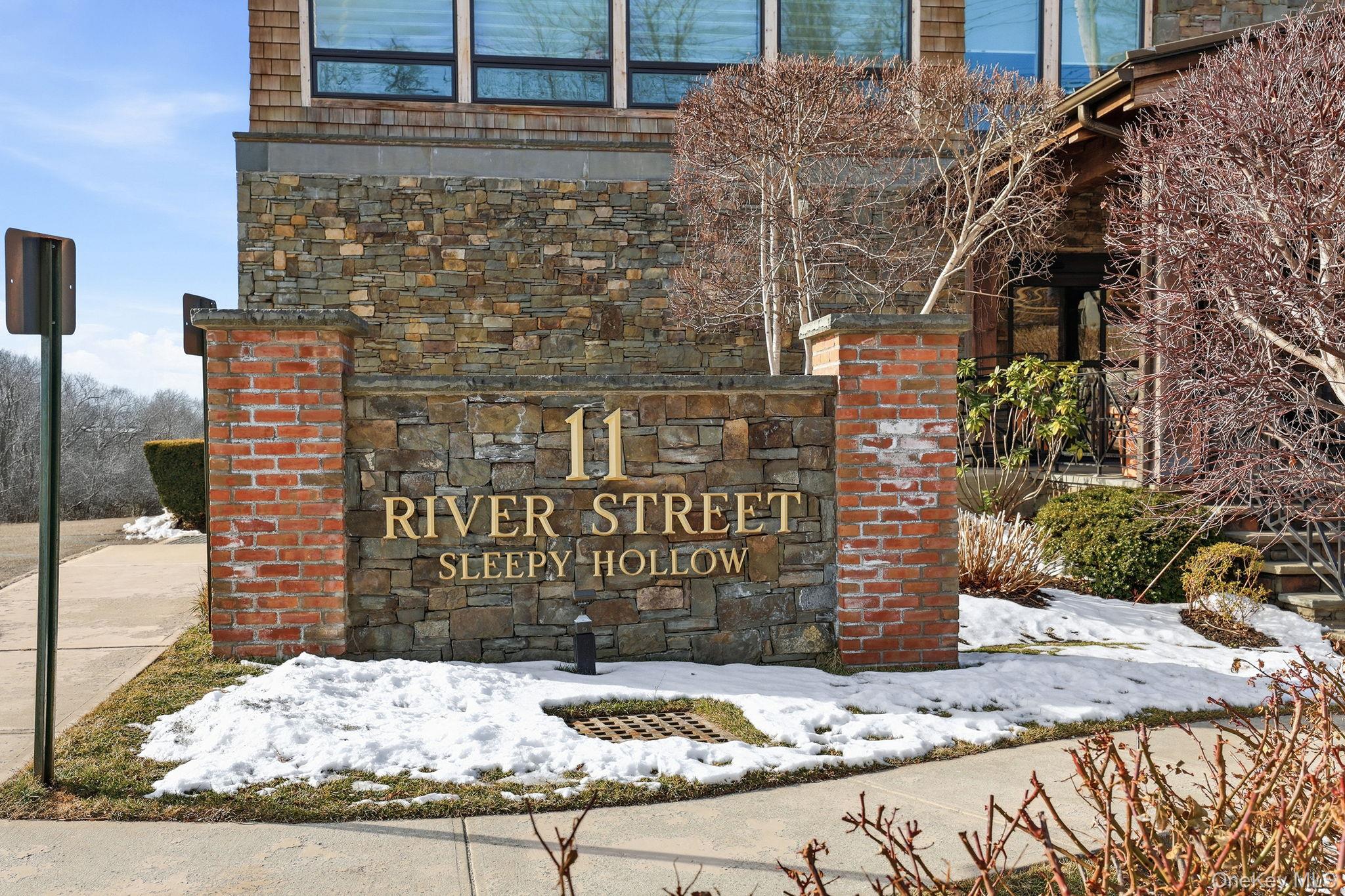 11 River Street, Unit 415 Sleepy Hollow, NY 10591 - Photo 33 of 37 a sign on the side of a building