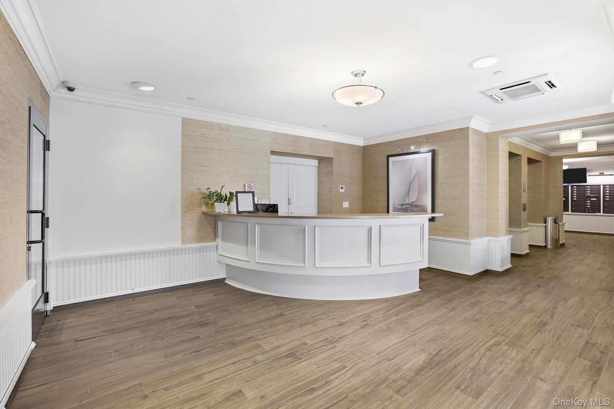11 River Street, Unit 415 Sleepy Hollow, NY 10591 - Photo 34 of 37 a view of kitchen and hall with wooden floor
