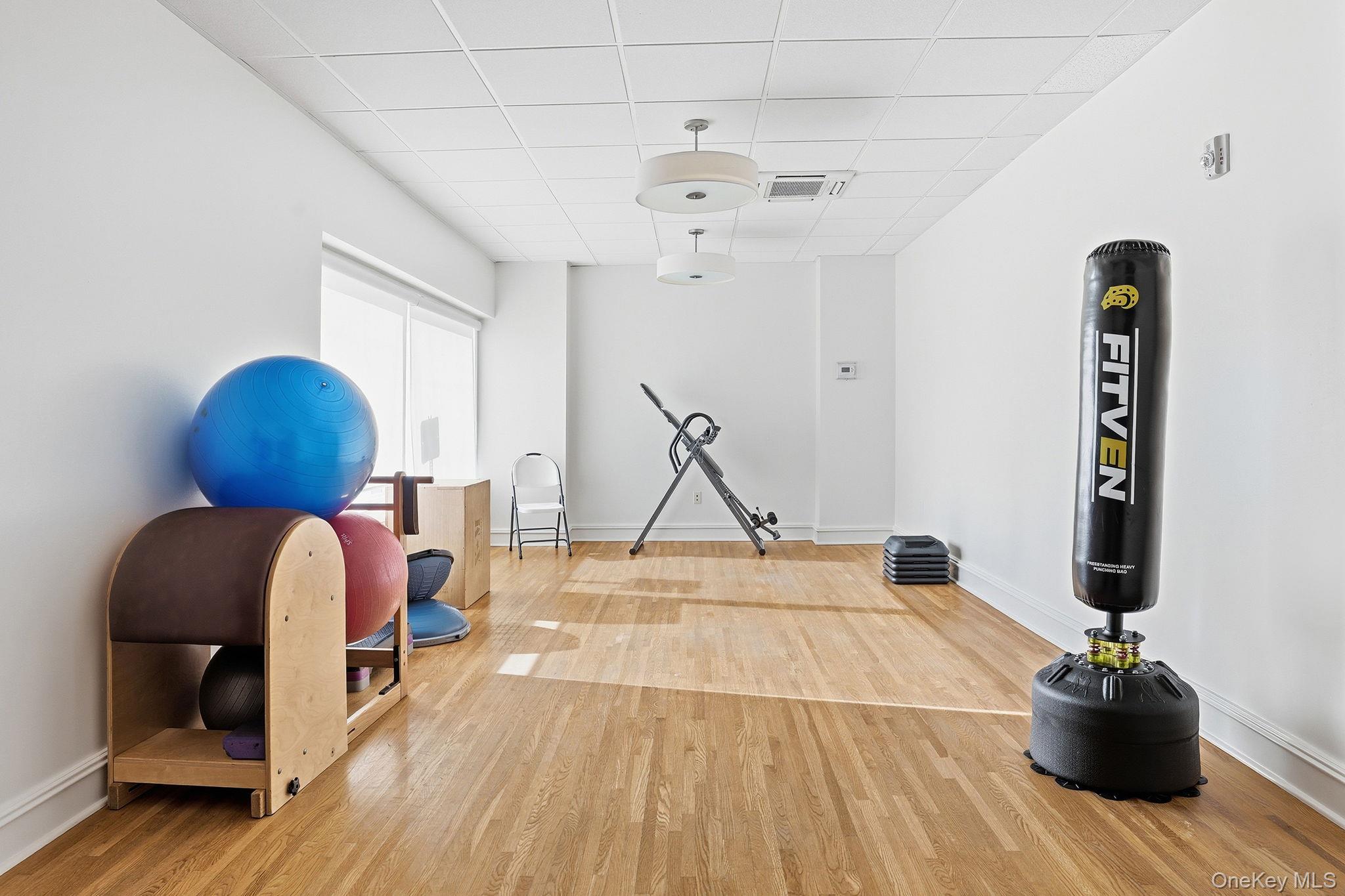 11 River Street, Unit 415 Sleepy Hollow, NY 10591 - Photo 36 of 37 a room with gym equipment and a rug