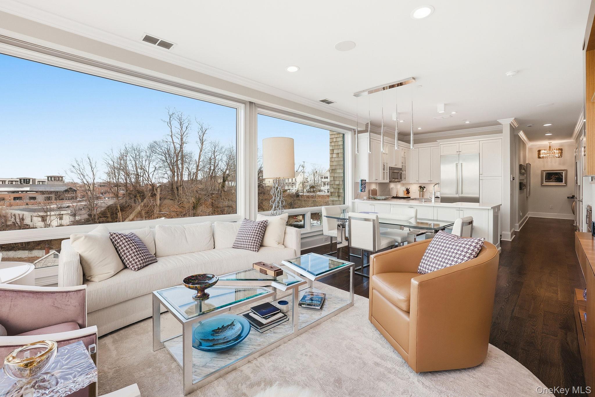 11 River Street, Unit 415 Sleepy Hollow, NY 10591 - Photo 6 of 37 a living room with furniture and a large window