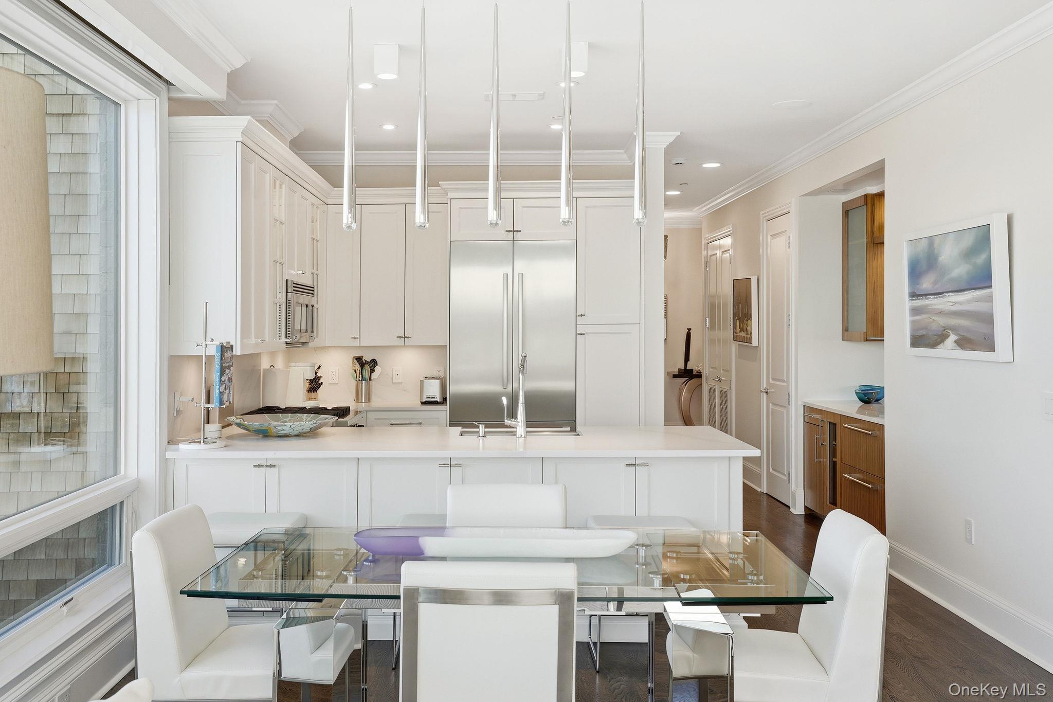 11 River Street, Unit 415 Sleepy Hollow, NY 10591 - Photo 9 of 37 a kitchen with granite countertop a sink and white appliances